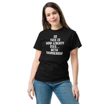 "So this is how liberty dies… with thunderous applause" printed on a black unisex classic tee worn by a female