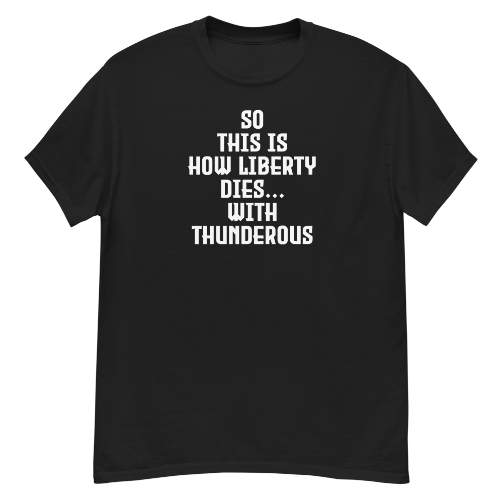 "So this is how liberty dies… with thunderous applause" printed on a black unisex classic tee laying on a flat surface