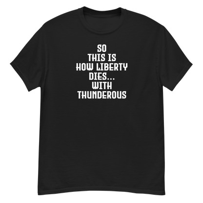 "So this is how liberty dies… with thunderous applause" printed on a black unisex classic tee laying on a flat surface