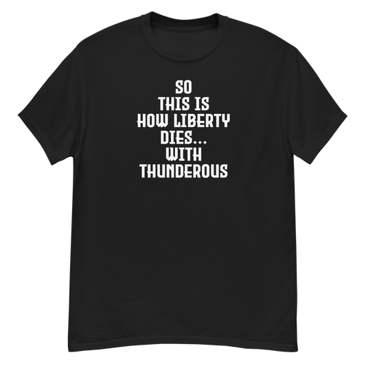 "So this is how liberty dies… with thunderous applause" printed on a black unisex classic tee laying on a flat surface