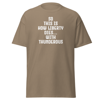 "So this is how liberty dies… with thunderous applause" printed on a brown savana on an invisible body