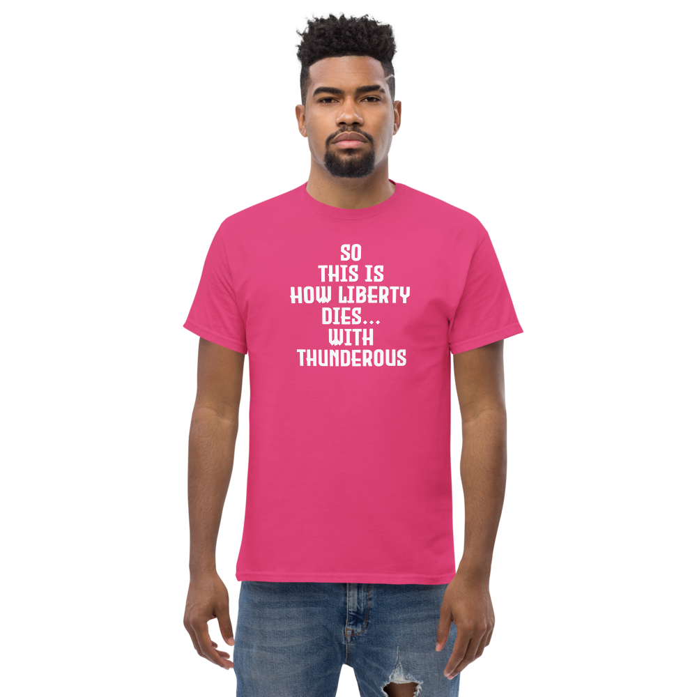 "So this is how liberty dies… with thunderous applause" printed on a heliconia unisex classic tee worn by a male