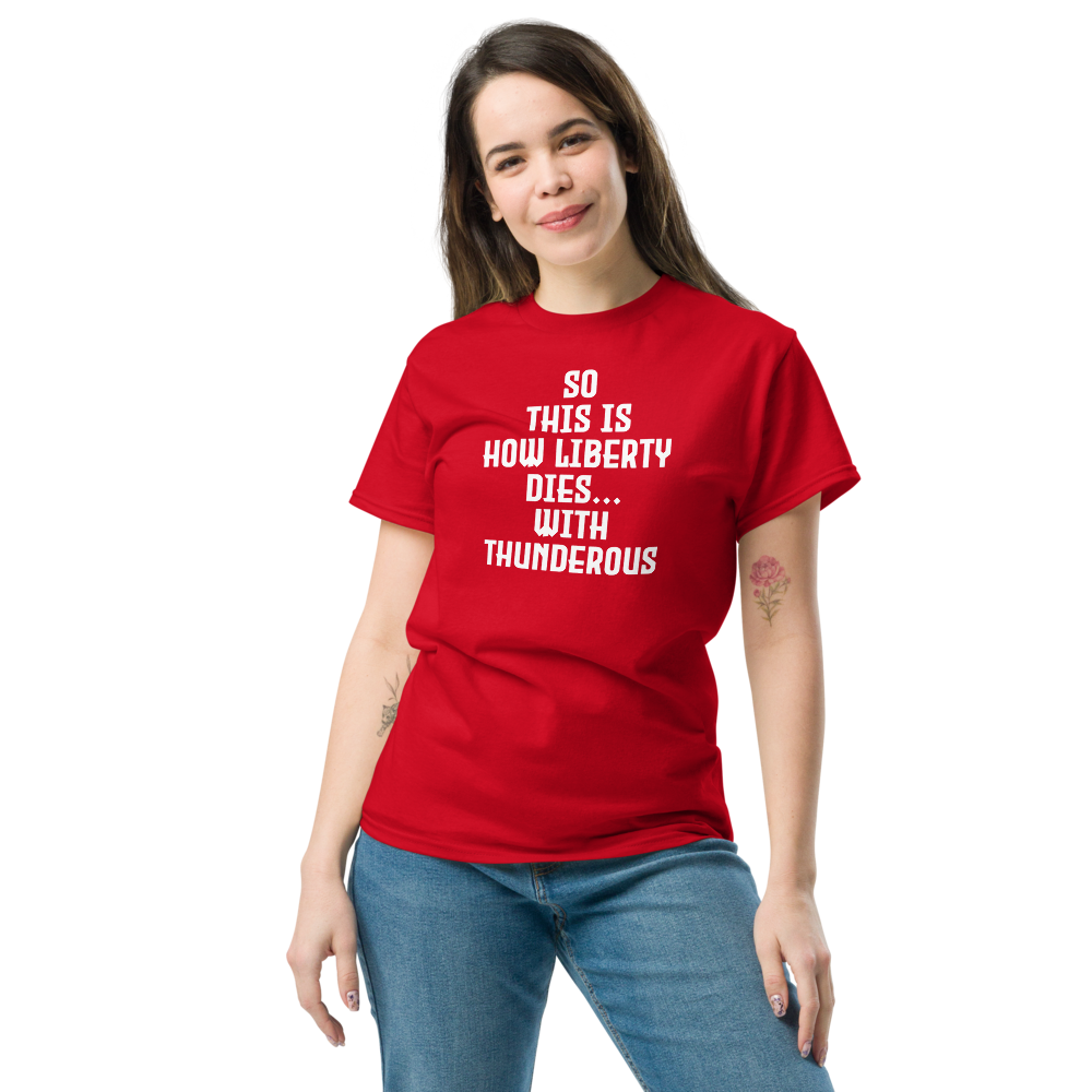 "So this is how liberty dies… with thunderous applause" printed on a red unisex classic tee worn by a female