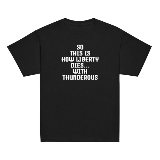 "So this is how liberty dies… with thunderous applause" printed on a black youth classic tee laying on a flat surface