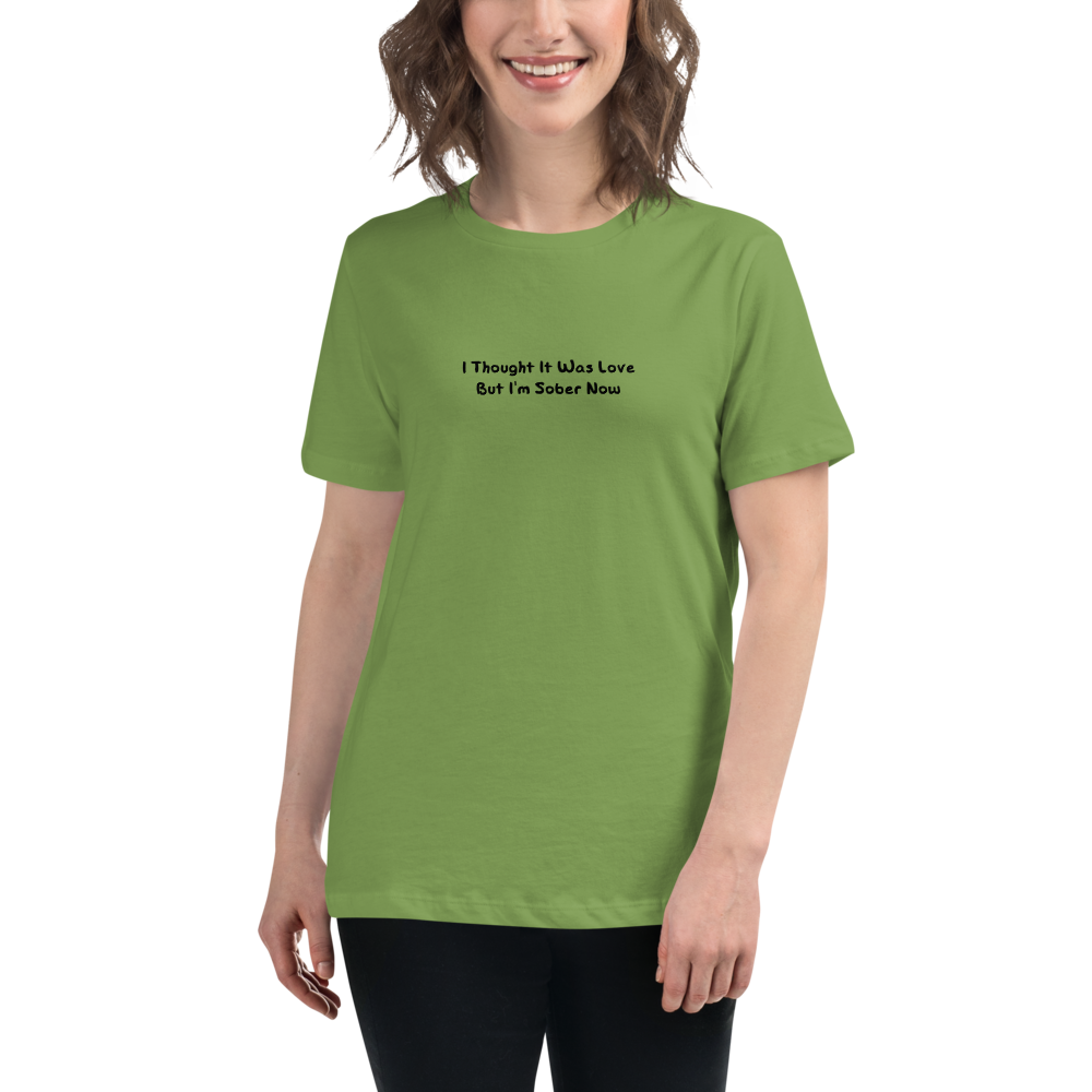 "I thought it was love but I’m sober now" printed on a leaf women's relaxed t-shirt worn by a female