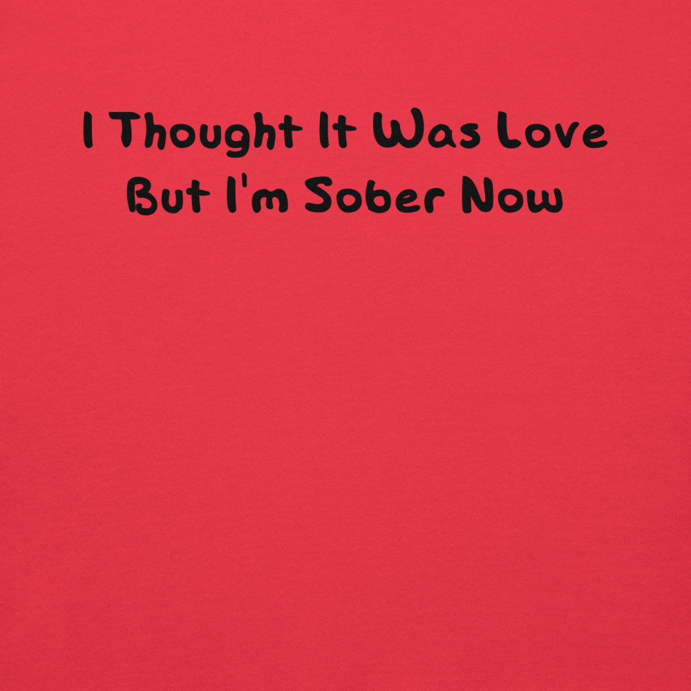 "I thought it was love but I’m sober now" printed on a team red background