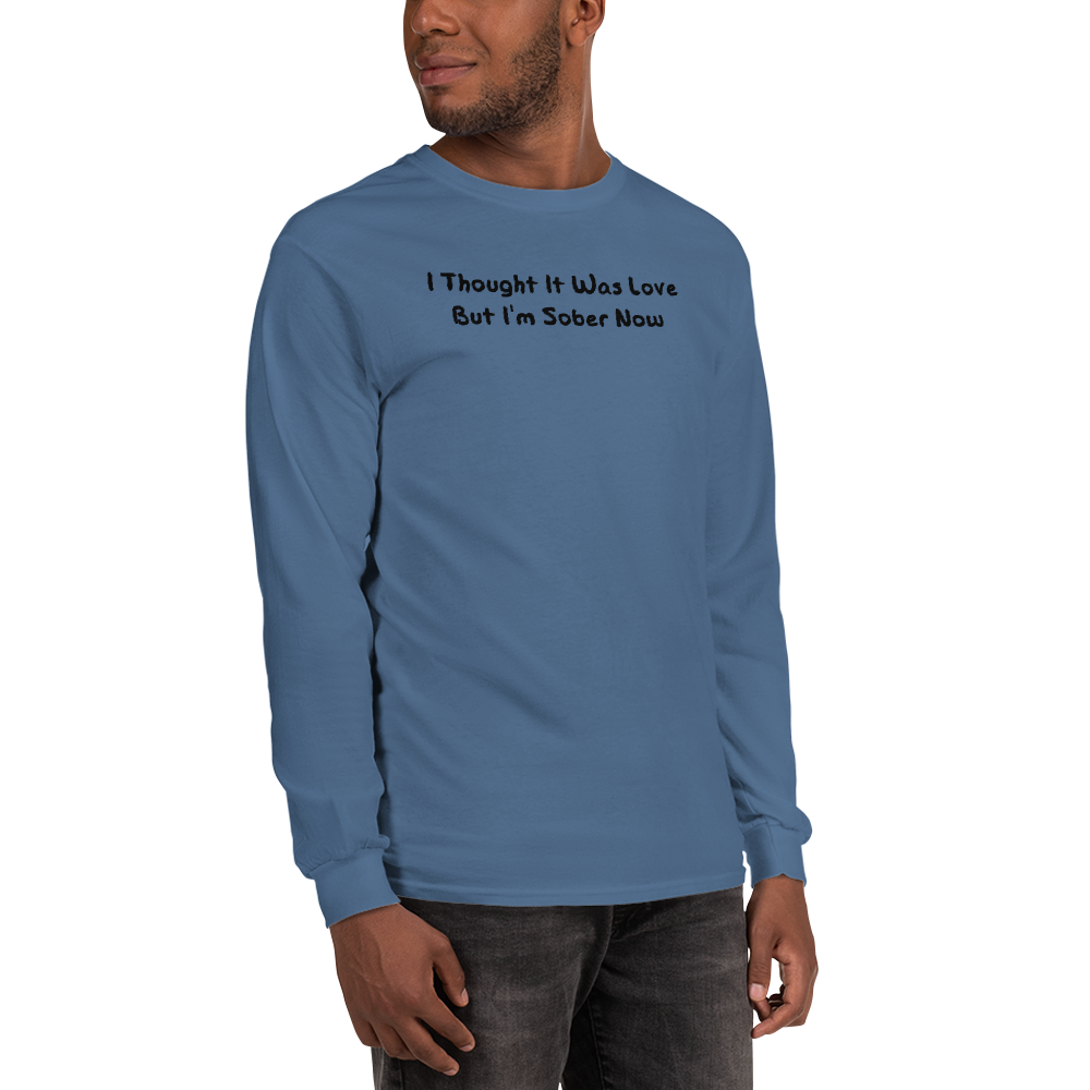 "I thought it was love but I’m sober now" printed on a indigo blue men's long sleeve shirt worn by a male