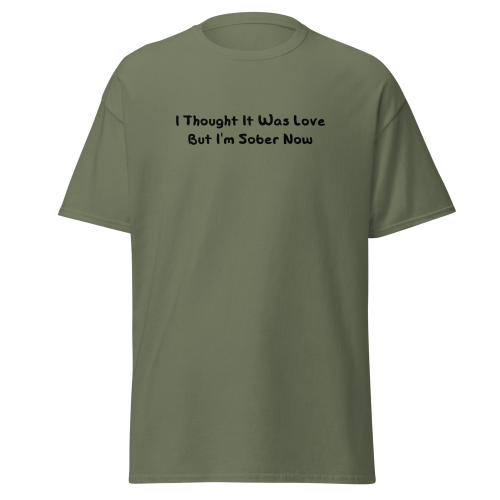 "I thought it was love but I’m sober now" printed on a military green on an invisible body