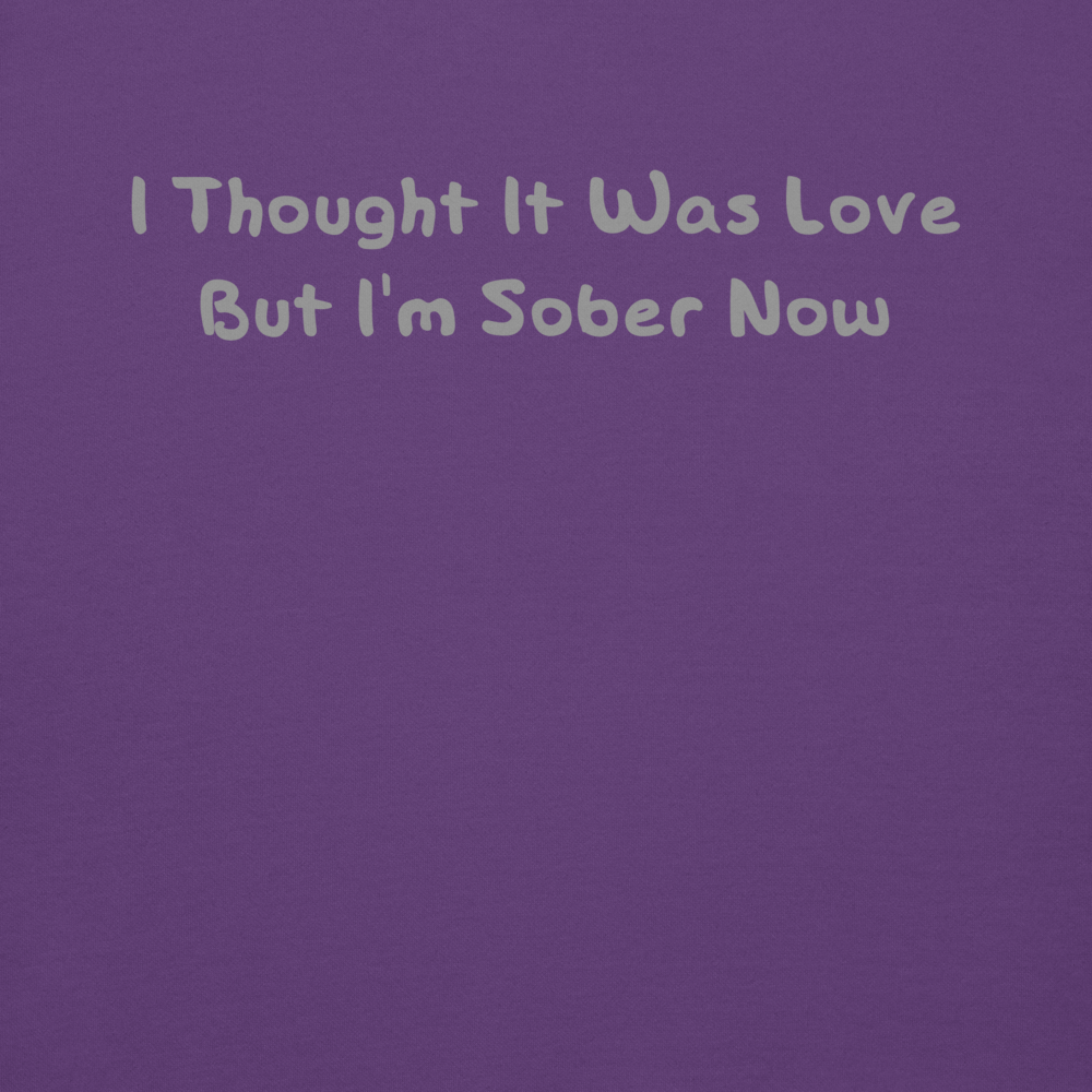 "I thought it was love but I’m sober now" printed on a purple background