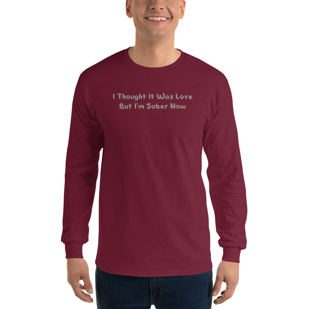 "I thought it was love but I’m sober now" printed on a maroon men's long sleeve shirt worn by a male