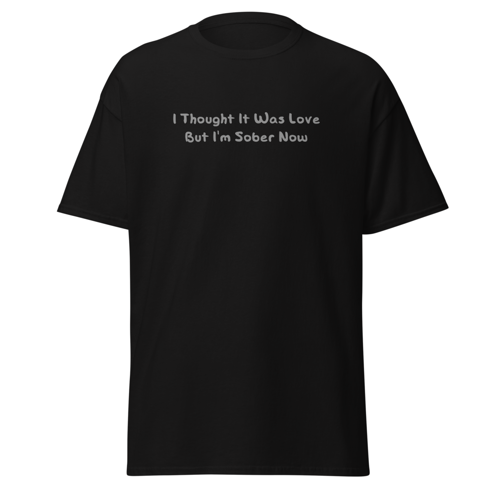 "I thought it was love but I’m sober now" printed on a black on an invisible body