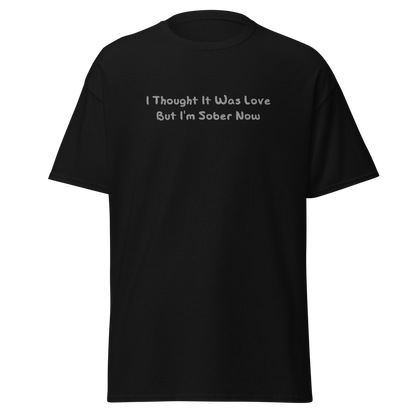 "I thought it was love but I’m sober now" printed on a black on an invisible body