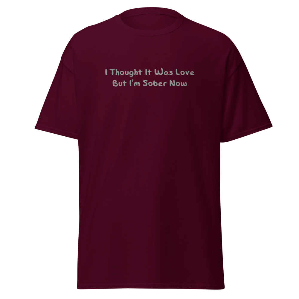 "I thought it was love but I’m sober now" printed on a maroon on an invisible body