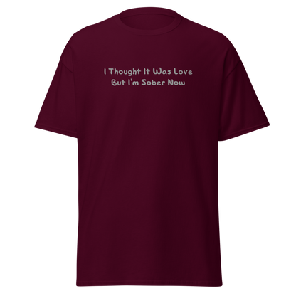 "I thought it was love but I’m sober now" printed on a maroon on an invisible body