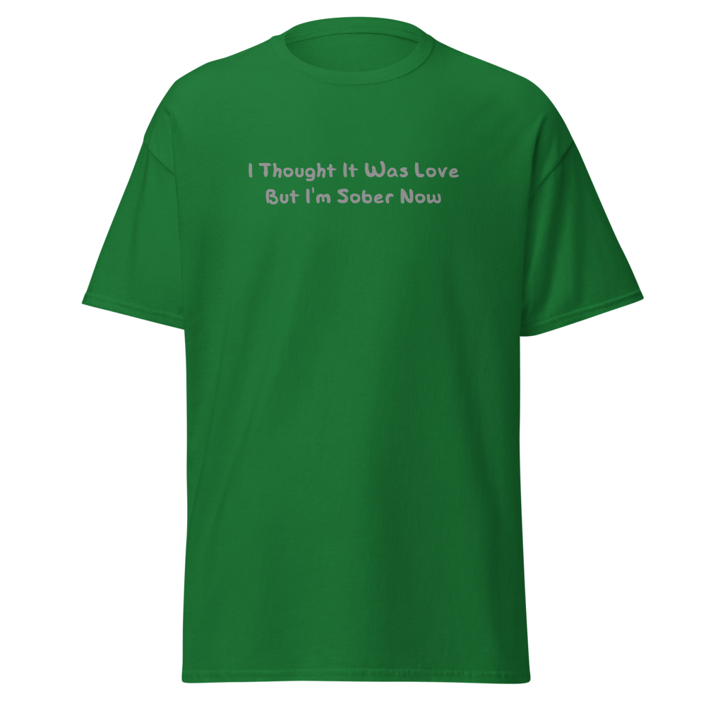 "I thought it was love but I’m sober now" printed on a turf green on an invisible body