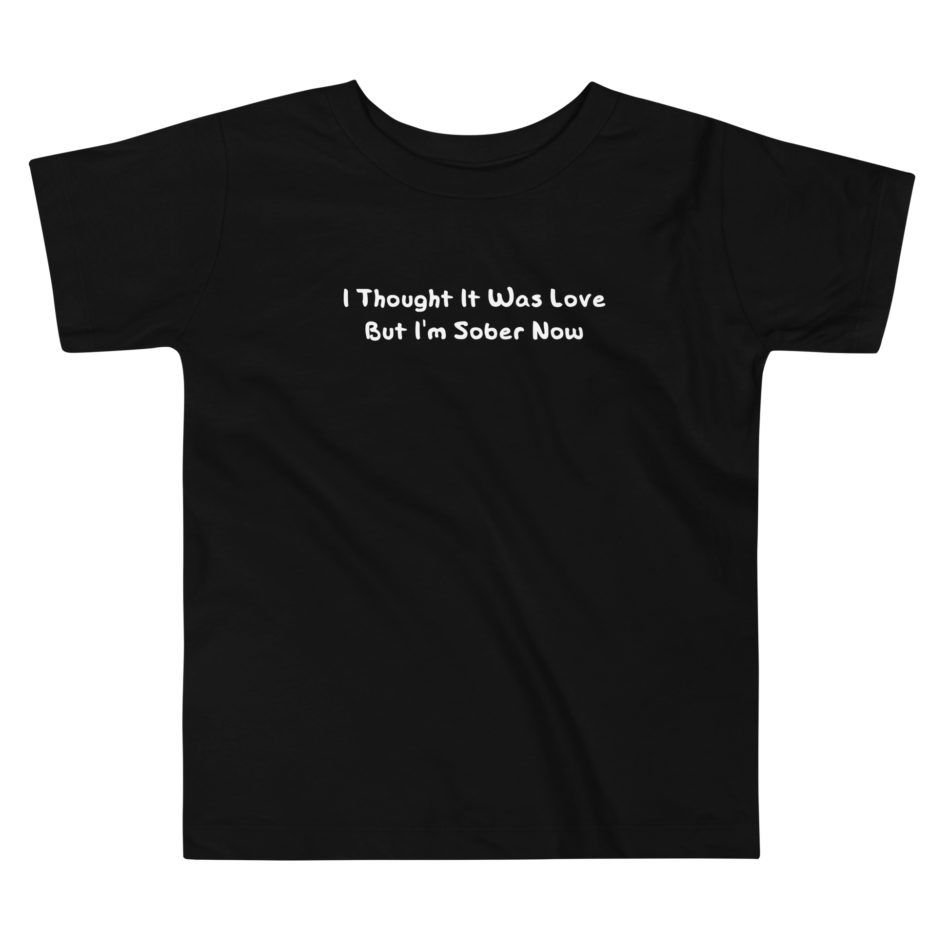 "I thought it was love but I’m sober now" printed on a black toddler short sleeve tee laying on a flat surface
