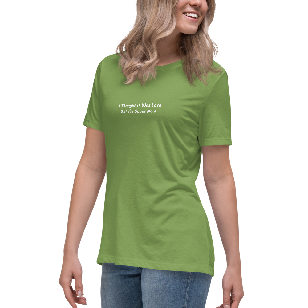 "I thought it was love but I’m sober now" printed on a leaf women's relaxed t-shirt worn by a female