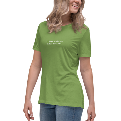 "I thought it was love but I’m sober now" printed on a leaf women's relaxed t-shirt worn by a female