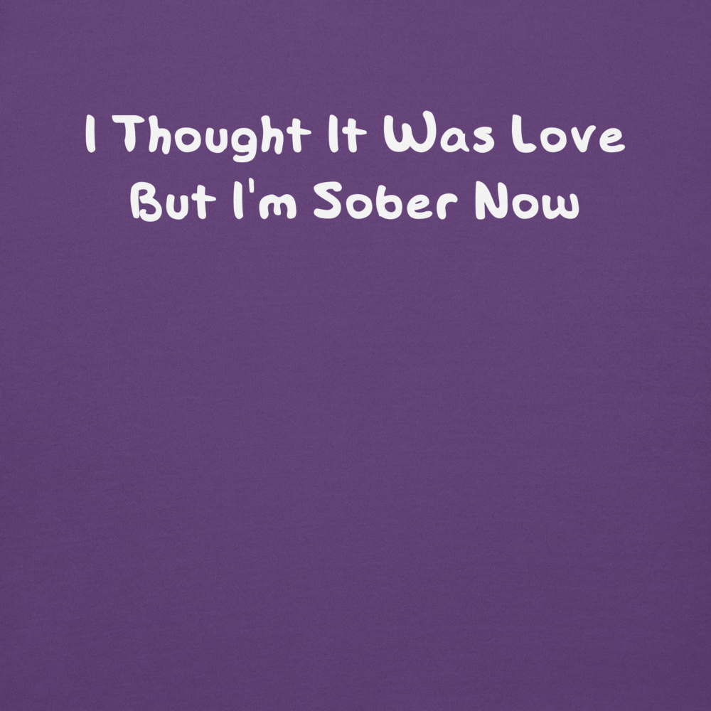 "I thought it was love but I’m sober now" printed on a purple background