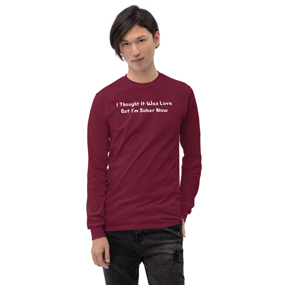 "I thought it was love but I’m sober now" printed on a maroon men's long sleeve shirt worn by a male