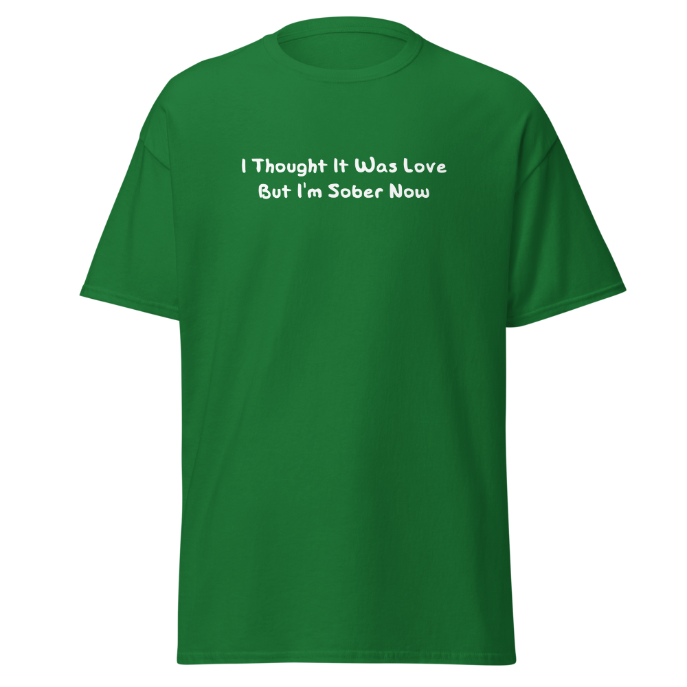 "I thought it was love but I’m sober now" printed on a turf green on an invisible body