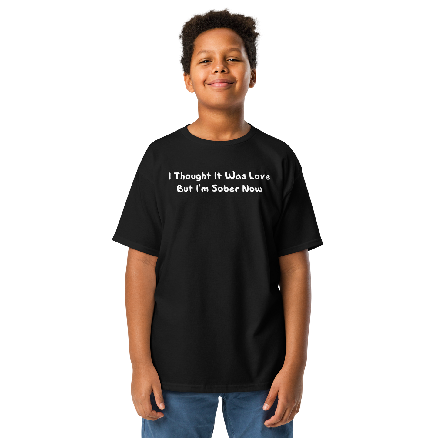 "I thought it was love but I’m sober now" printed on a black youth classic tee worn by a male