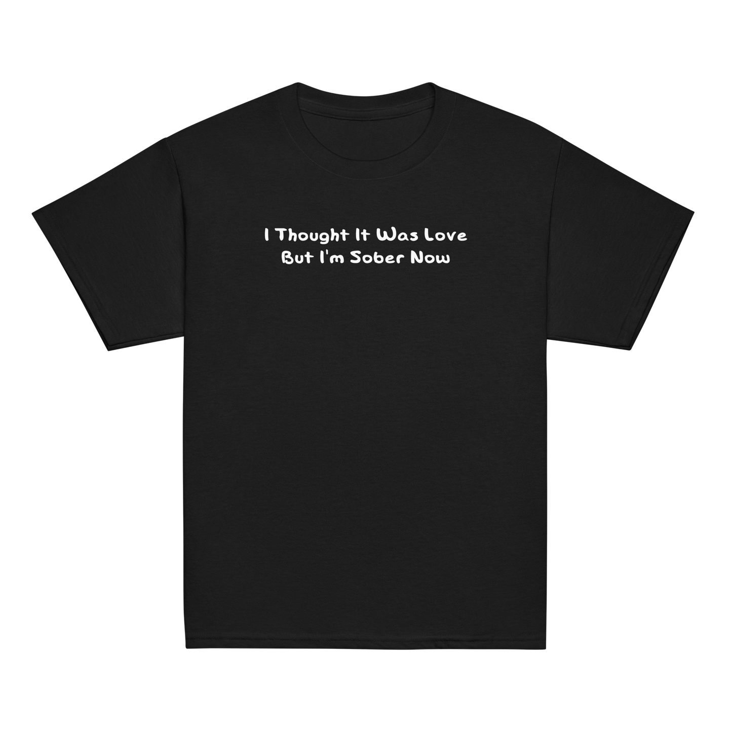"I thought it was love but I’m sober now" printed on a black youth classic tee laying on a flat surface
