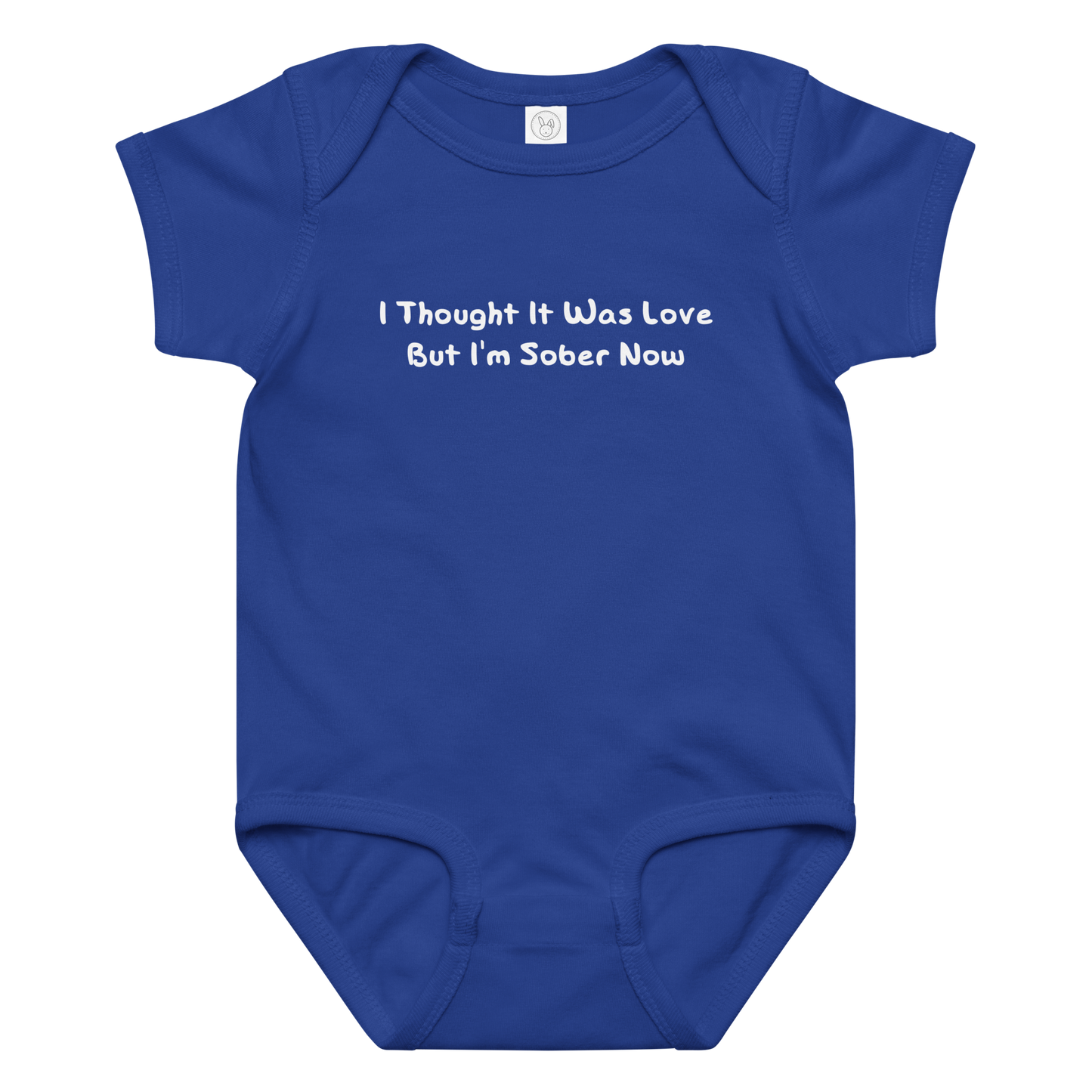 "I thought it was love but I’m sober now" printed on a royal baby jersey bodysuit laying on a flat surface amongst other clothes