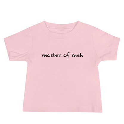 "Master of meh" printed on a pink baby jersey short sleeve tee laying on a flat surface