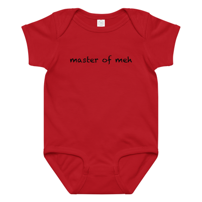 "Master of meh" printed on a red baby jersey bodysuit laying on a flat surface amongst other clothes