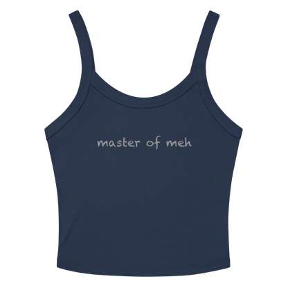 "Master of meh" printed on a solid navy blend women's micro-rib tanktop laying on a flat surface amongst sunglasses and shorts