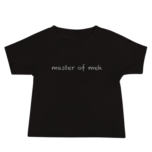 "Master of meh" printed on a black baby jersey short sleeve tee laying on a flat surface