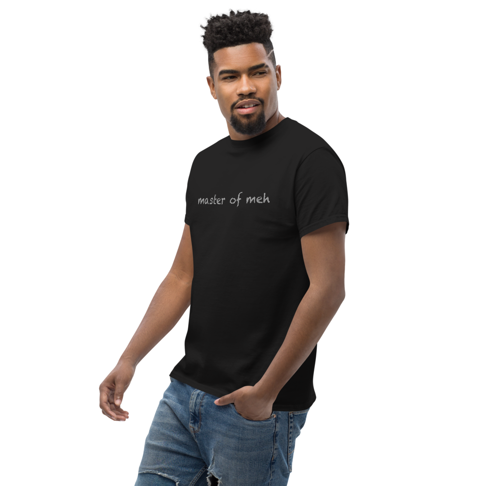 "Master of meh" printed on a black unisex classic tee worn by a male