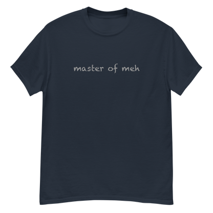 "Master of meh" printed on a navy unisex classic tee laying on a flat surface