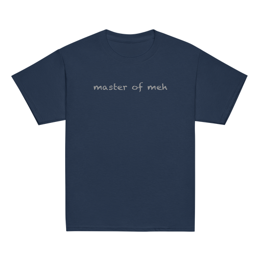 "Master of meh" printed on a navy youth classic tee laying on a flat surface