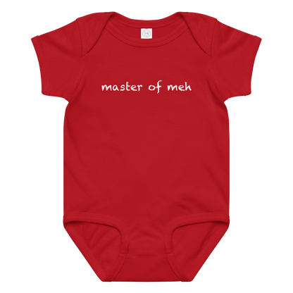 "Master of meh" printed on a red baby jersey bodysuit laying on a flat surface amongst other clothes