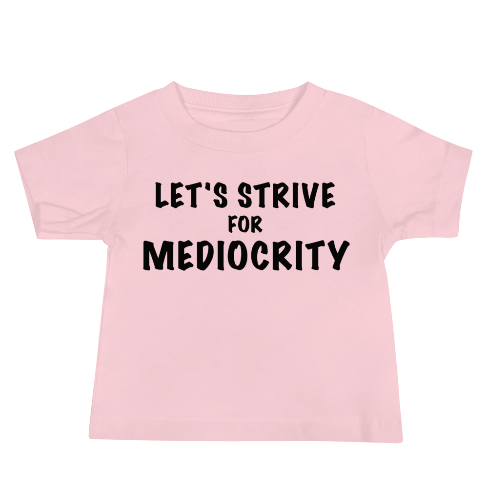 "Let's strive for mediocity" printed on a pink baby jersey short sleeve tee laying on a flat surface