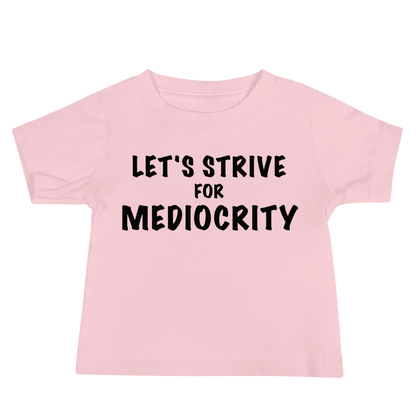 "Let's strive for mediocity" printed on a pink baby jersey short sleeve tee laying on a flat surface