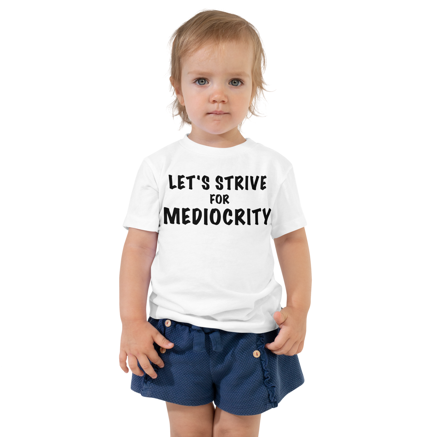 "Let's strive for mediocity" printed on a white toddler short sleeve tee worn by a female