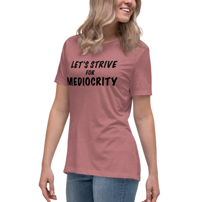 "Let's strive for mediocity" printed on a heather mauve women's relaxed t-shirt worn by a female
