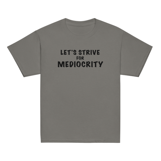 "Let's strive for mediocity" printed on a charcoal youth classic tee laying on a flat surface