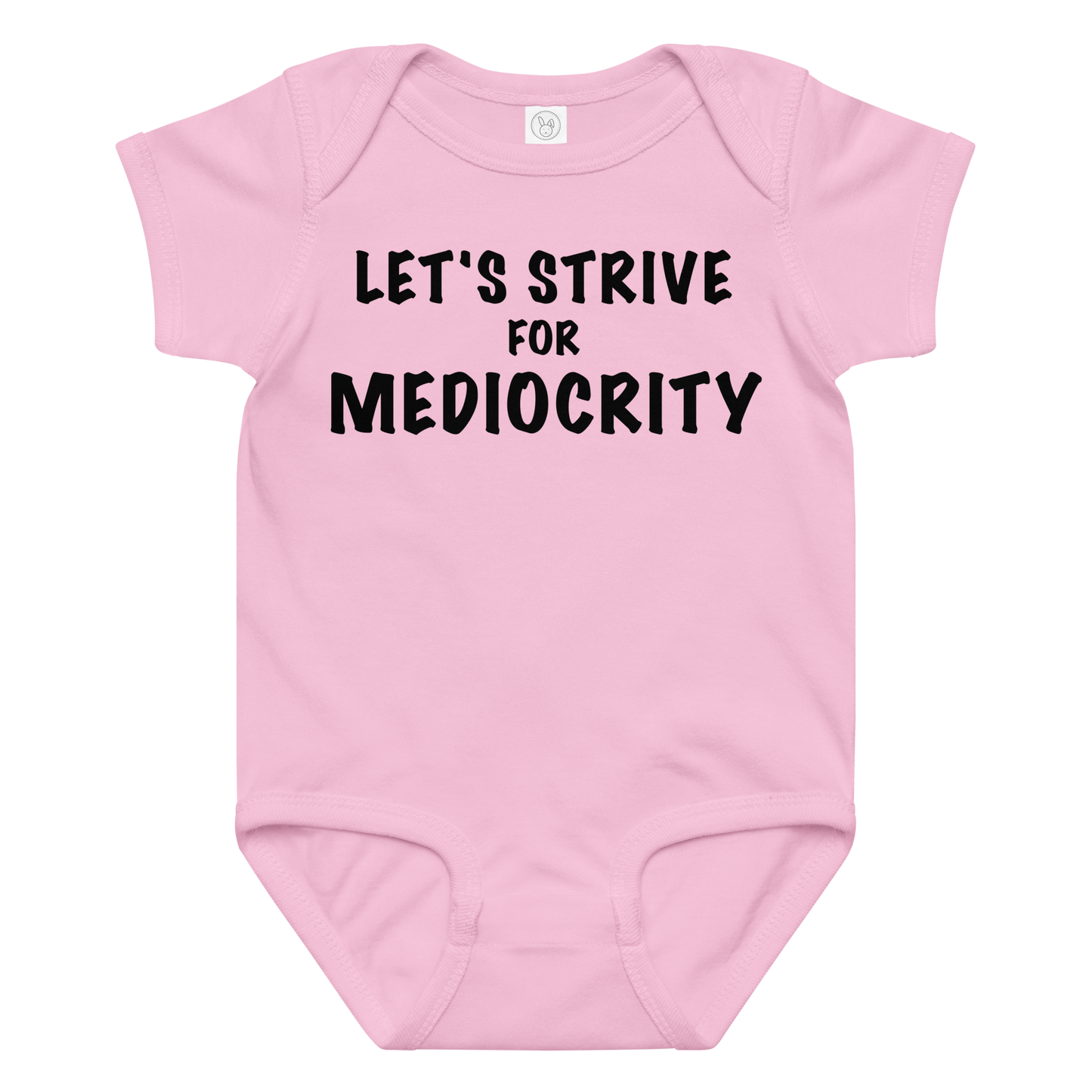 "Let's strive for mediocity" printed on a pink baby jersey bodysuit laying on a flat surface amongst other clothes
