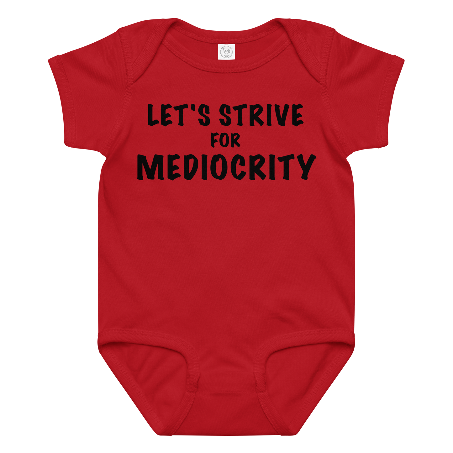 "Let's strive for mediocity" printed on a red baby jersey bodysuit laying on a flat surface amongst other clothes
