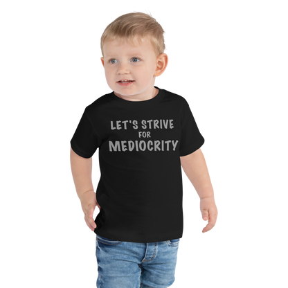 "Let's strive for mediocity" printed on a black toddler short sleeve tee worn by a male
