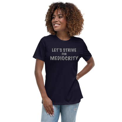"Let's strive for mediocity" printed on a navy women's relaxed t-shirt worn by a female