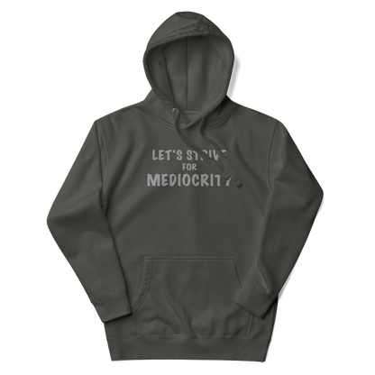 "Let's strive for mediocity" printed on a vintage black unisex hoodie laying on a flat surface with the hood up