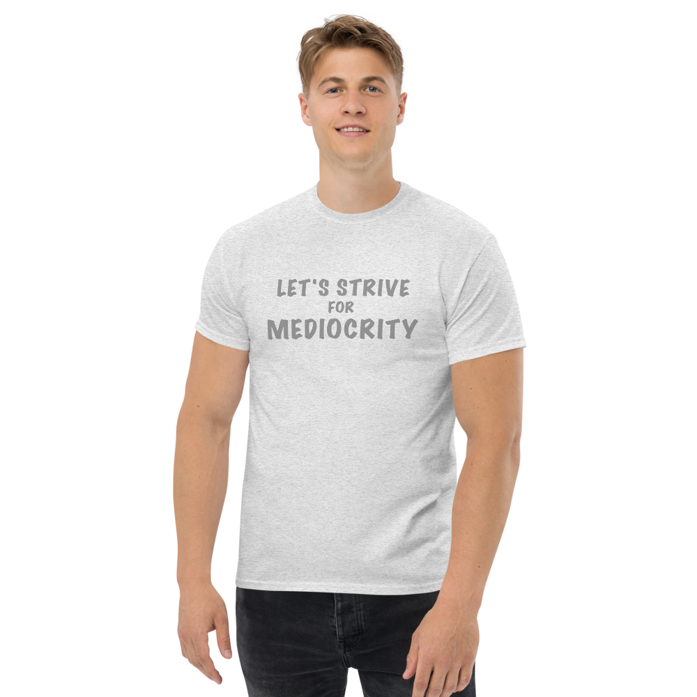 "Let's strive for mediocity" printed on a ash unisex classic tee worn by a male