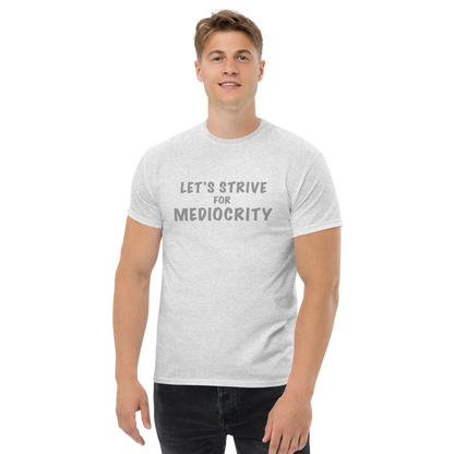 "Let's strive for mediocity" printed on a ash unisex classic tee worn by a male