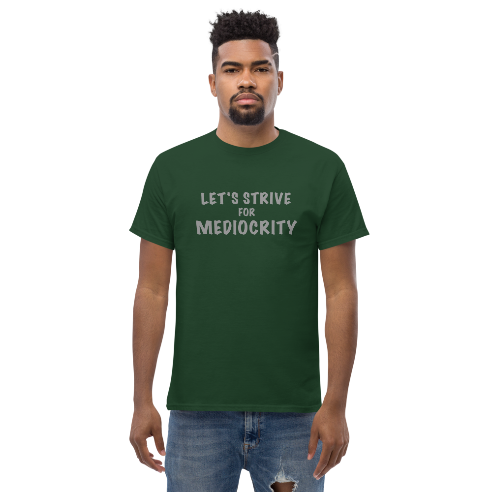 "Let's strive for mediocity" printed on a forest green unisex classic tee worn by a male