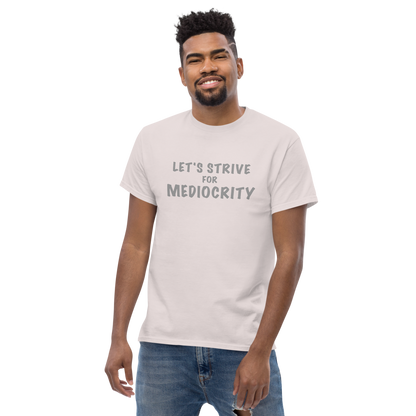 "Let's strive for mediocity" printed on a ice grey unisex classic tee worn by a male